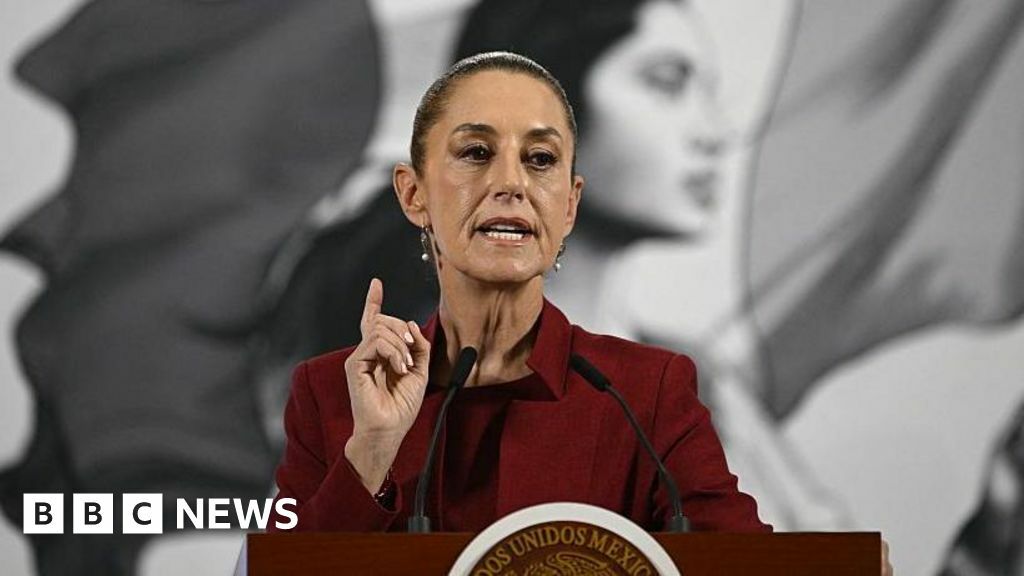 An image of President of Mexico Claudia Sheinbaum in a red suit.