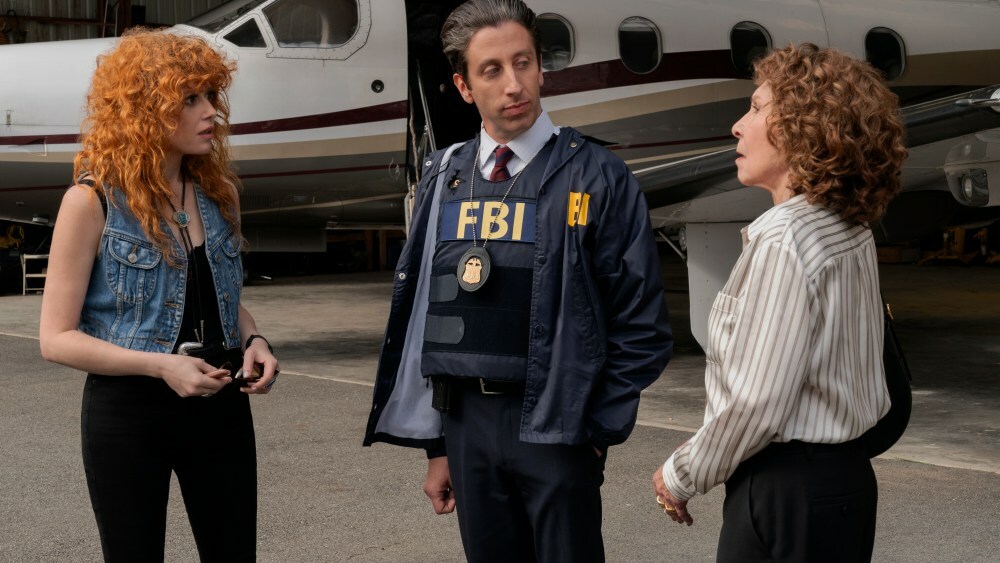 POKER FACE -- “Whack-A-Mole” Episode 203 -- Pictured: (l-r) Natasha Lyonne as Charlie Cale, Simon Helberg as Luca, Rhea Perlman as Beatrix Hasp -- (Photo by: Ralph Bavaro/PEACOCK)