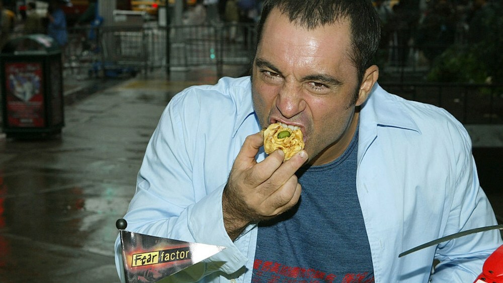NEW YORK - JULY 12:  Fear Factor host Joe Rogan makes an appearance in Times Square to celebrate the show's 100th episode July 12, 2004 in New York City.  (Photo by Peter Kramer/Getty Images)