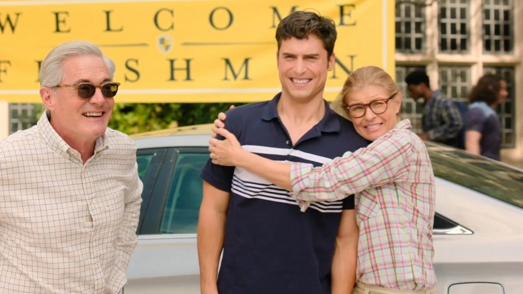 Connie Britton hugs Benito Skinner as they arrive with Kyle McLachlan at a college with a "Welcome Freshmen" banner behind them in 'Overcompensating'.