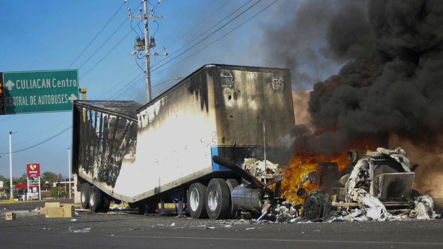 A truck burns on a street in Culiacan, Sinaloa state, Thursday, Jan. 5, 2023. (AP Photo/Martin Urista, file)