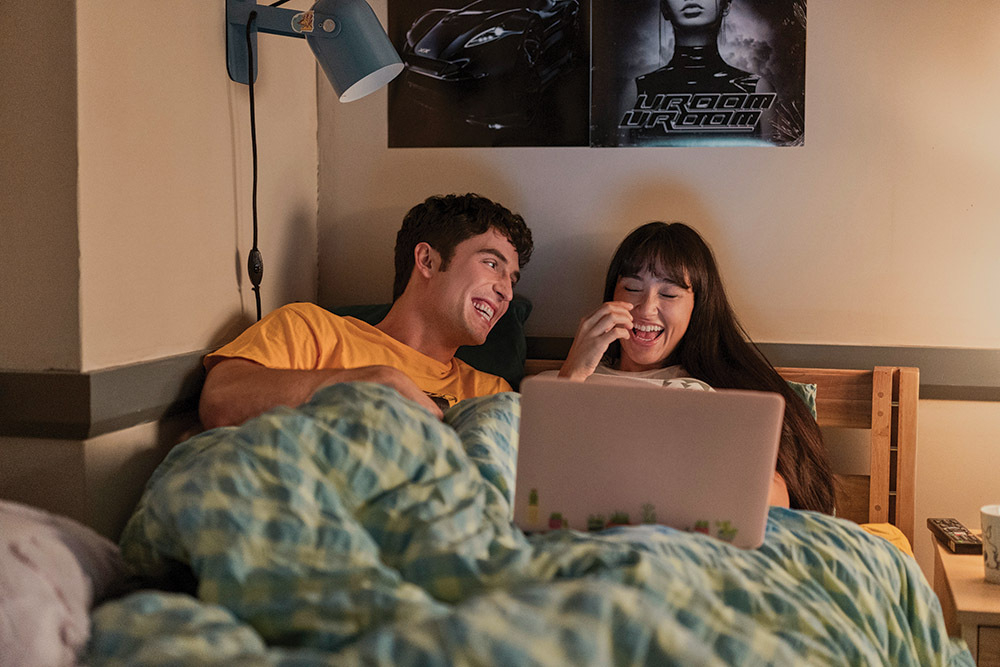 Benito Skinner and Baram in a scene from Prime Video’s Overcompensating, premiering May 15.