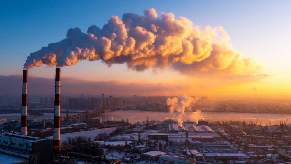 2 chimneys and smoke.