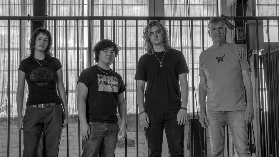 Black Flag's Greg Ginn with vocalist Max Zanelly, bassist David Rodriguez, and drummer Bryce Weston
