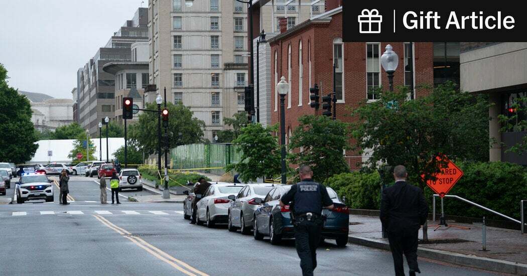 Law enforcement officials walked toward the site of the shooting near the Capital Jewish Museum in Washington, D.C., on Thursday. 