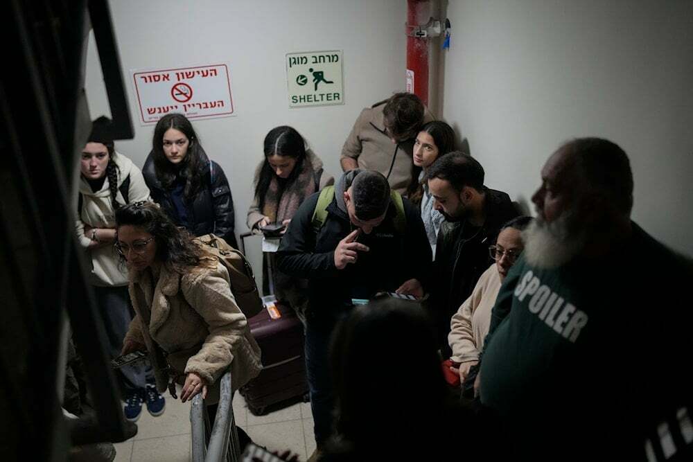 Israelis gather in a shelter after airstrike sirens sounded off in Ben Gurion Airport, near Tel Aviv, “Israel”, early Friday, Jan. 3, 2024. (AP )