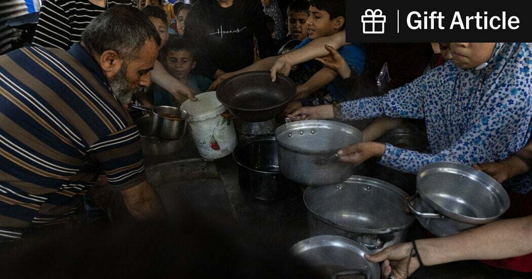 Displaced people at a charity food kitchen in Gaza City on Wednesday.