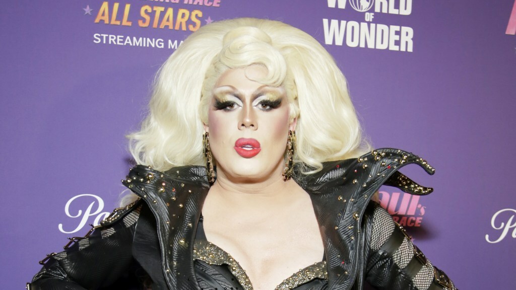Tina Burner poses on a red carpet.
