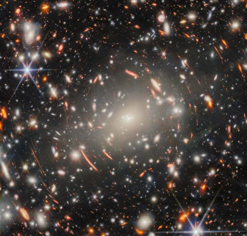 In this picture of the month, the JWST uses gravitational lensing to bring distant galaxies into view. Image Credit: ESA/Webb, NASA & CSA, H. Atek, M. Zamani (ESA/Webb)