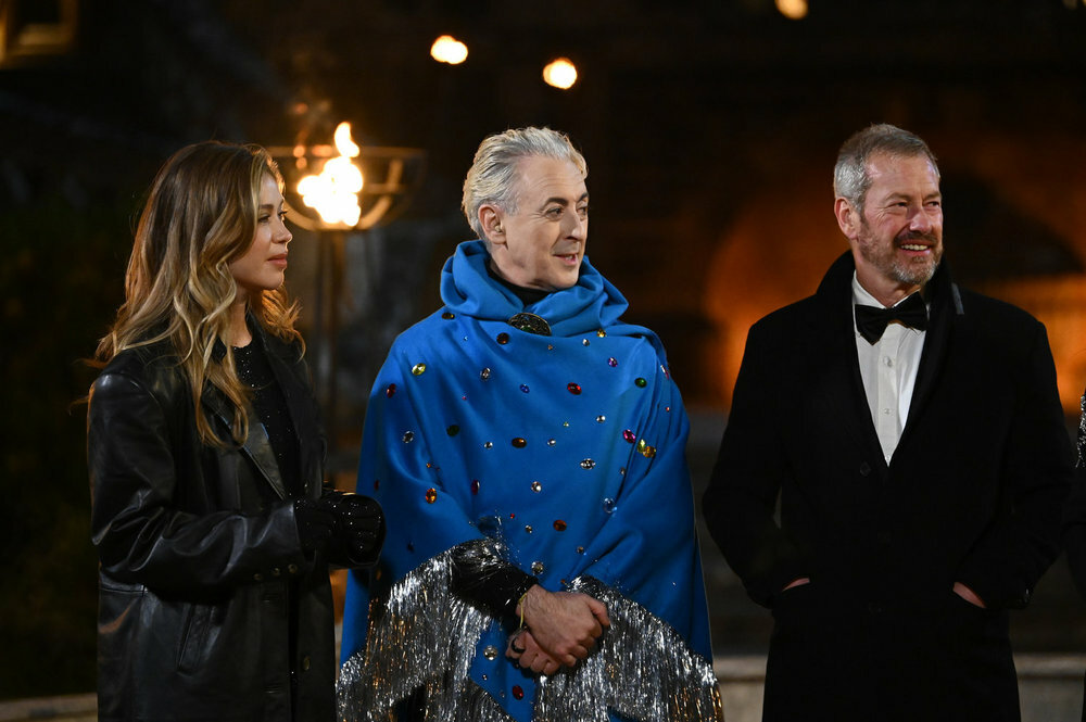 Gabby Windey, Alan Cumming, Lord Ivar Mountbatten in a scene from The Traitors TV series