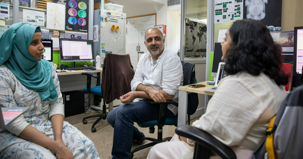 Dr. Raj Ladher, a professor at the National Center for Biological Sciences in Bangalore, India, with Ph.D. students.