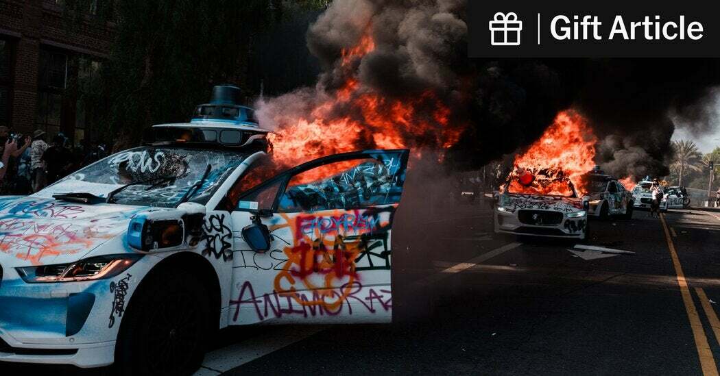 A Waymo self-driving car was vandalized and set on fire at a protest in Los Angeles on Sunday.