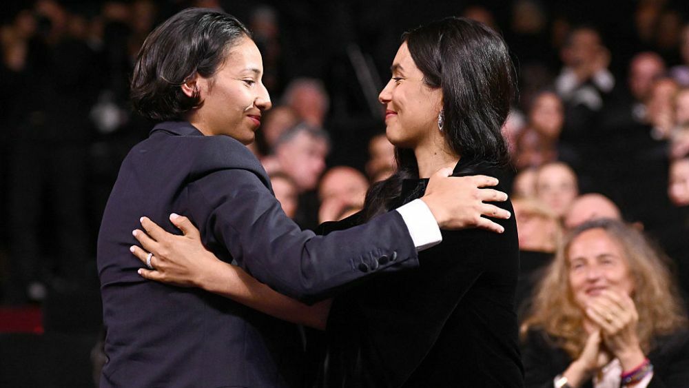 CANNES, FRANCE - MAY 24: Nadia Melliti and Hafsia Herzi accepts the Best Actress Award for "The Little Sister" onstage during the closing ceremony at the 78th annual Cannes Film Festival at Palais des Festivals on May 24, 2025 in Cannes, France. (Photo by Stephane Cardinale - Corbis/Corbis via Getty Images)