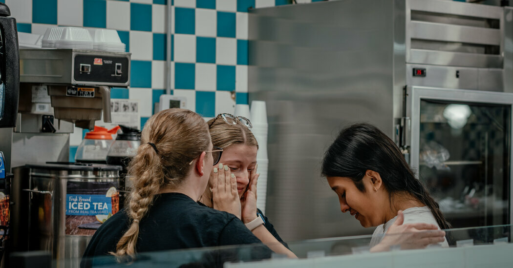 Restaurant employees in Kennett, Mo., after seeing a co-worker during a video meeting from where she was held in immigration detention in May.
