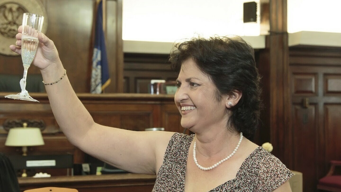 In this undated photo provided by her daughter, Mandonna "Donna" Kashanian, 64, holds up a champagne glass. (Kaitlynn Milne via AP)