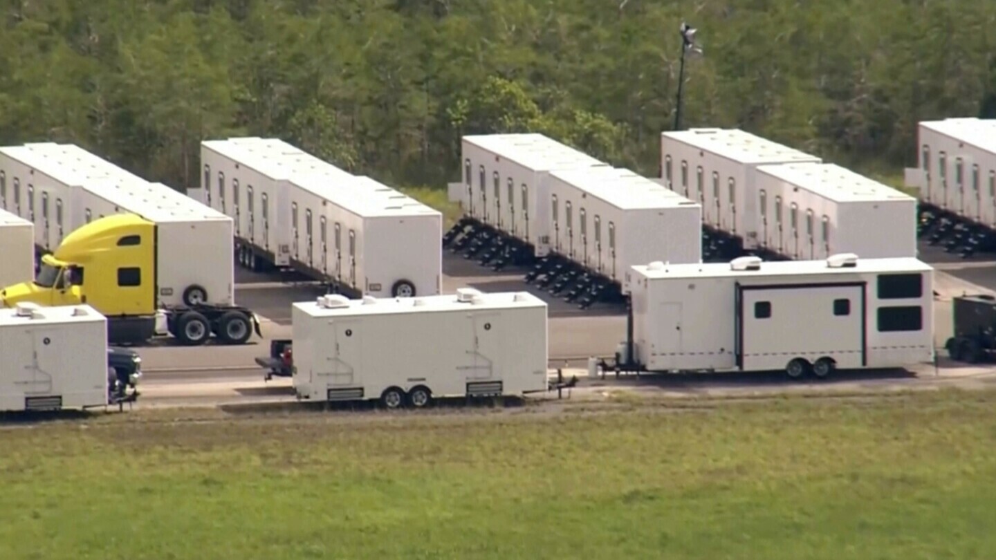This image grab from video shows activity at an immigration detention facility dubbed “Alligator Alcatraz” located at an isolated Everglades airfield. (WSVN via AP)