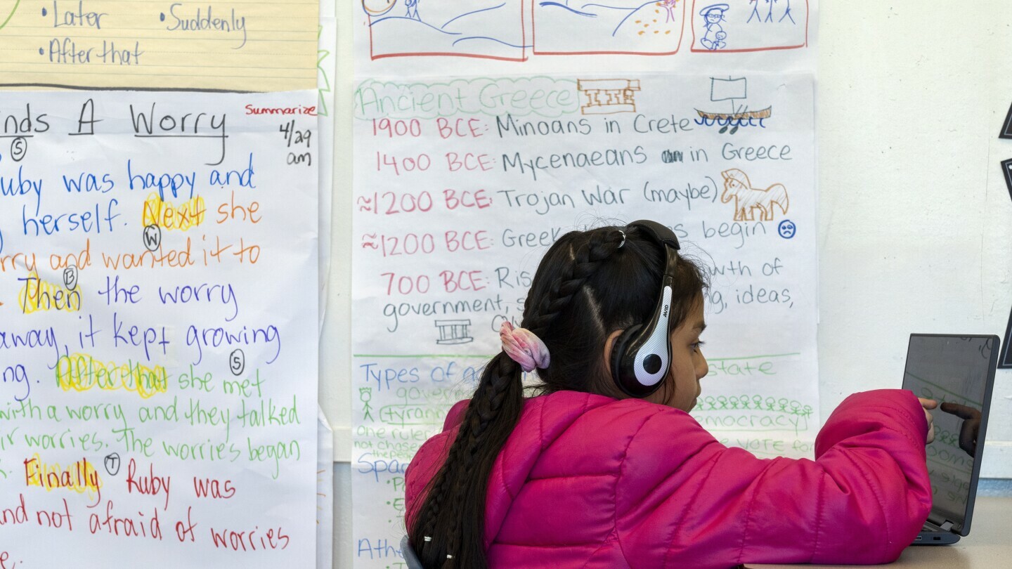 Jaelene, 9, works on a computer during a third grade English language arts class at Mount Vernon Community School, in Alexandria, Va., May 1, 2024. (AP Photo/Jacquelyn Martin, File)