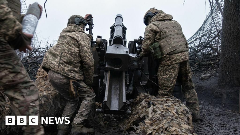 An artillery unit from Ukraine's Khartiia Brigade prepare to fire a US-made M101A1 Towed Howitzer near a frontline in the Kharkiv region, Ukraine