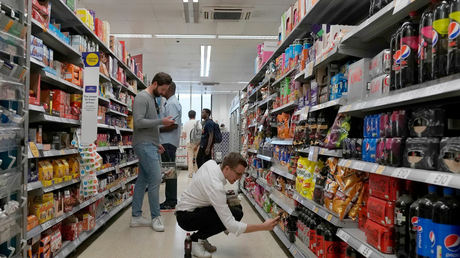 People in a supermarket. | Copyright 2022 The Associated Press.