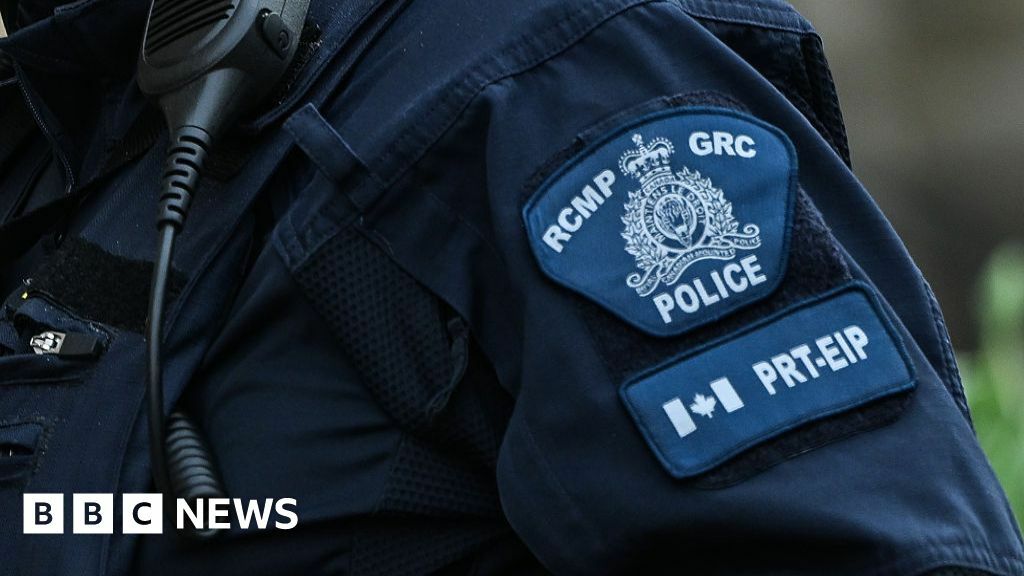 A generic style image of a patch on the arm of a police officer saying 'RCMP GRC' A generic style image of a patch on the arm of a police officer saying 'RCMP GRC'
