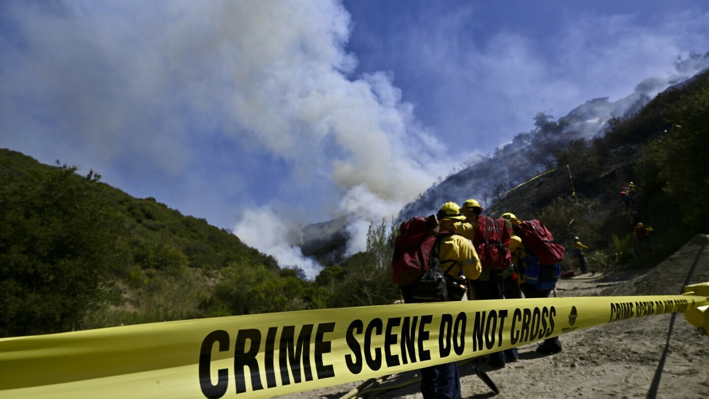 Smoke fills the sky as firefighters battle the Rancho Fire in Laguna Beach, Calif., on Monday, July 7, 2025. (Jeff Gritchen/The Orange County Register via AP)