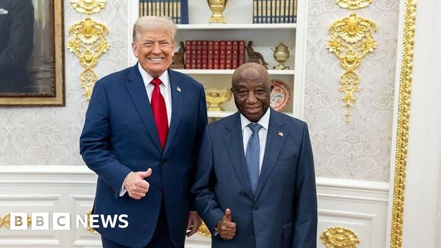 Donald Trump and Joseph Boakai smiling for the camera with their thumbs up