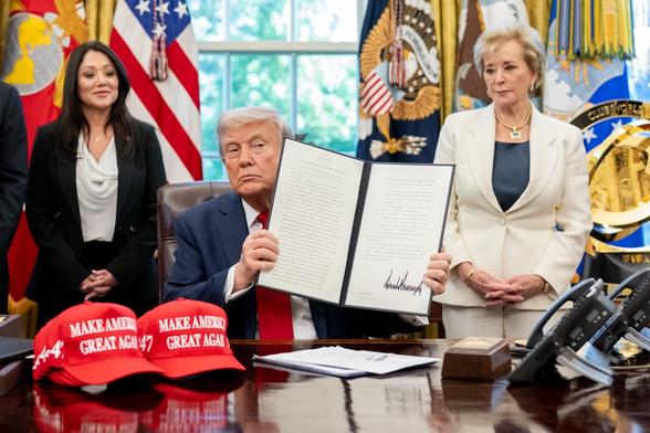 President Donald Trump signs executive orders alongside Secretary of Education Linda McMahon, right, Wednesday, April 23, 2025. (Official White House Photo by Molly Riley)