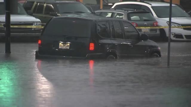 This image made from video shows cars submerged in floodwaters in Rahway, NJ., on July 14, 2025.(WABC-TV via AP)