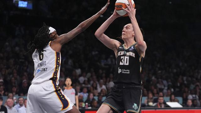 New York Liberty's Breanna Stewart (30) shoots over Indiana Fever's Natasha Howard (6) during the first half of a WNBA basketball game Wednesday, July 16, 2025, in New York. (AP Photo/Frank Franklin II)