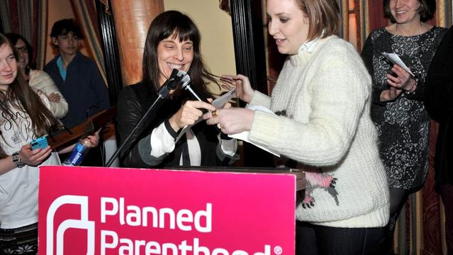 PARK CITY, UT - JANUARY 25:  Director at Planned Parenthood Federation of America Caren Spruch (L) and actress Lena Dunham speak during Sex, Politics And Film Hosted By Lena Dunham And Planned Parenthood Action Fund - 2015 Park City at Wahso Asian Grill on January 25, 2015 in Park City, Utah.  (Photo by Sonia Recchia/Getty Images)