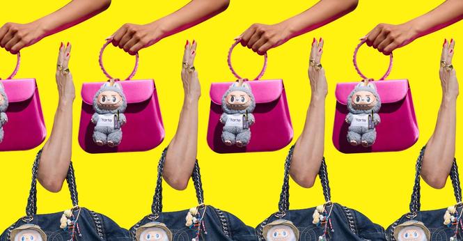Handbags with Labubu toys hanging on the outside.
