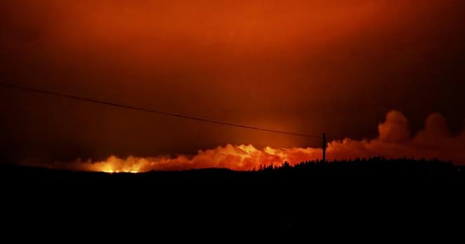 An out-of-control wildfire is shown in this handout photo near Musgrave Harbour, N.L., just before midnight on July 20, 2025. THE CANADIAN PRESS/Handout — Kyle Gaulton (Mandatory Credit)