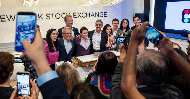 Figma’s co-founder and chief executive, Dylan Field, with a hand on his right shoulder, before ringing the bell at the New York Stock Exchange on Thursday.