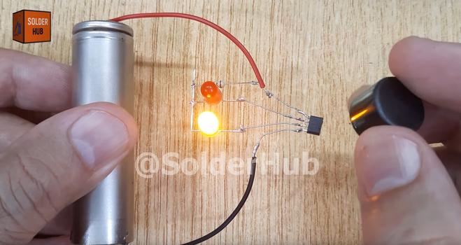 A photo of the air-wired circuit, with one LED on and the other off. A photo of the air-wired circuit, with one LED on and the other off.