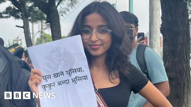Tanuja Pandey holding a paper showing an anti-corruption slogan during the Gen-Z protests in Nepal Tanuja Pandey holding a paper showing an anti-corruption slogan during the Gen-Z protests in Nepal