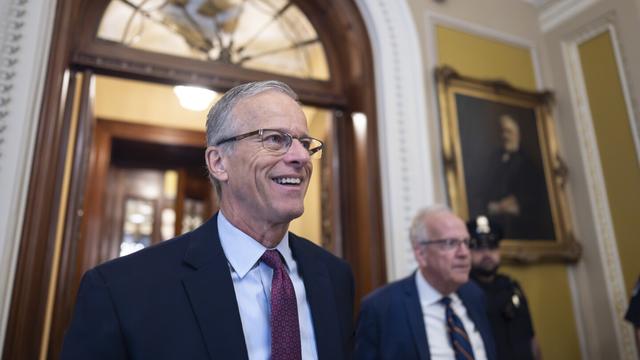 Senate Majority Leader John Thune, R-S.D., is met by reporters as he walks to his office while Congress works on a government funding solution, at the Capitol in Washington, Thursday, Sept. 18, 2025. (AP Photo/J. Scott Applewhite)