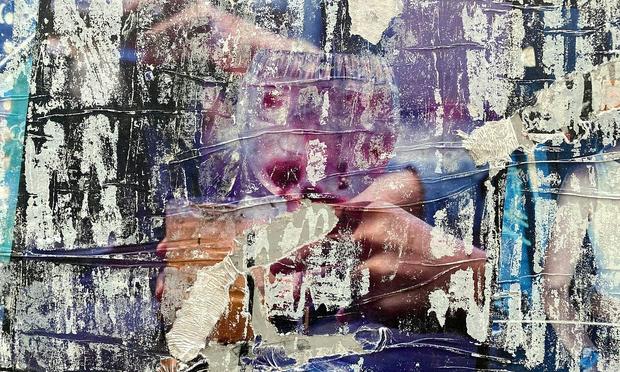 Hands are hidden behind an abstract painting. Hands are hidden behind an abstract painting.