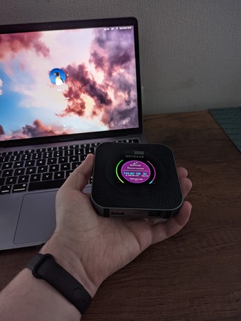 Holding router in hand to show its (small) size 