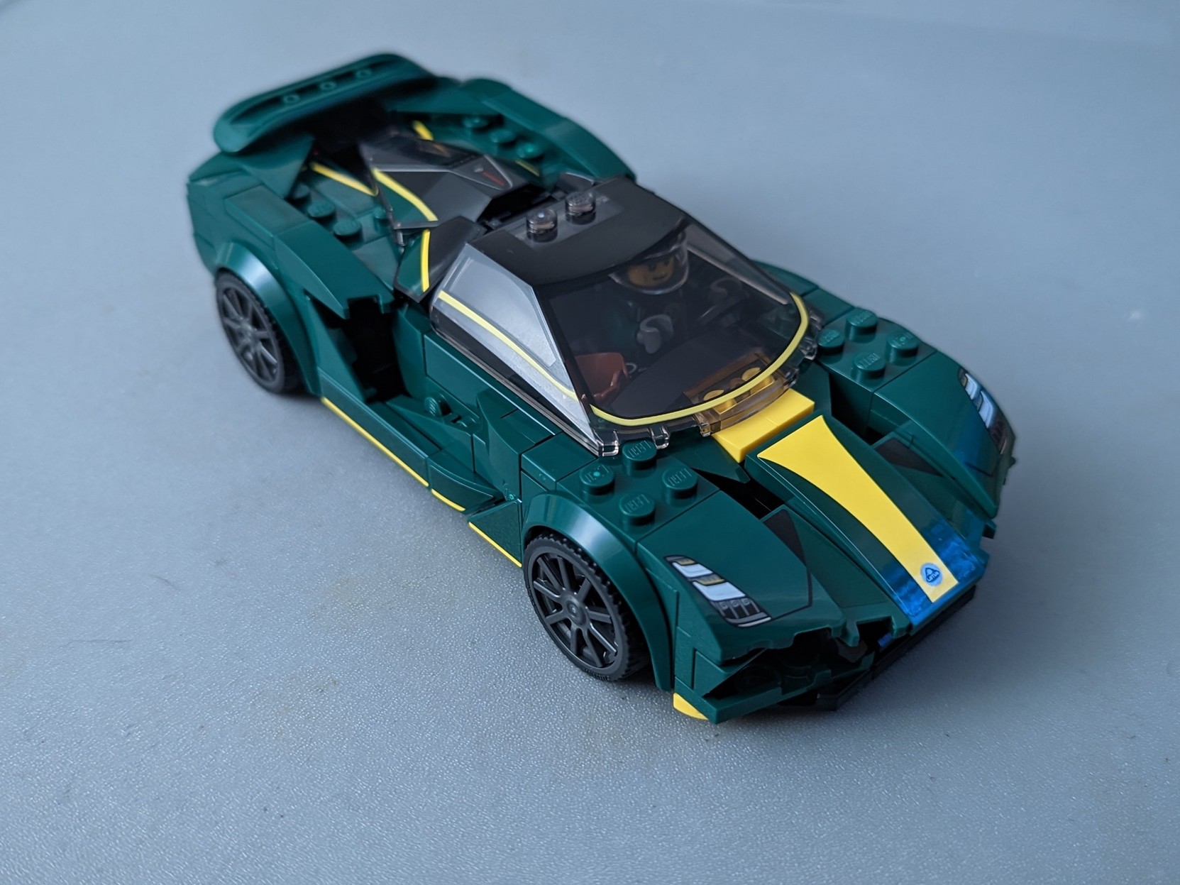 A completed Lego Lotus Evija #76907 on a grey background
