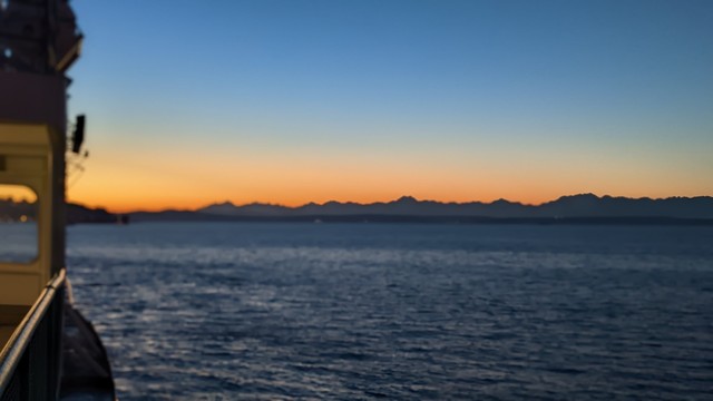 The Olympic Mountains glow red