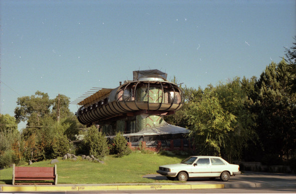 Bizarre house that looks like a cross between a UFO, a caterpillar, and an augur.