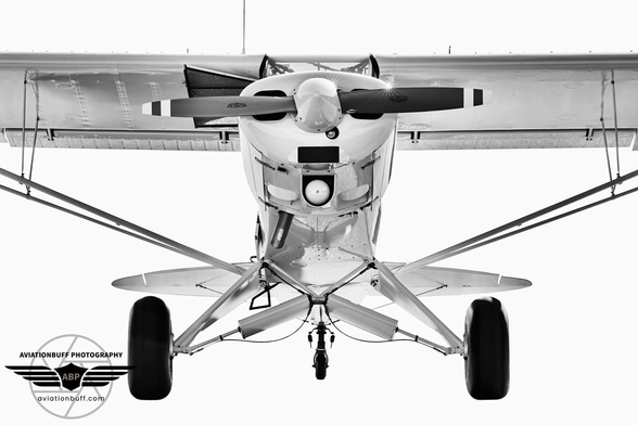 Front end of a Piper Cub in Black and White