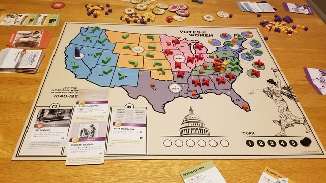 The Votes for Women game board at the end of the game. We have converted our political power into votes for (green check) and against (red X) the amendment. I only needed 13 states to block and pulled it off before we entered final voting.

It is noteworthy that my dice rolling is apparently SIGNIFICANTLY better when I'm the patriarchy.
