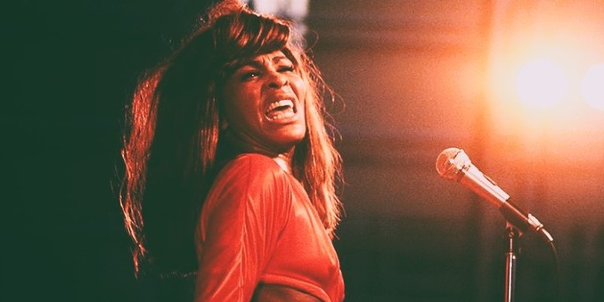 An image of Tina Turner from the 1970s shows the late singer in performance.