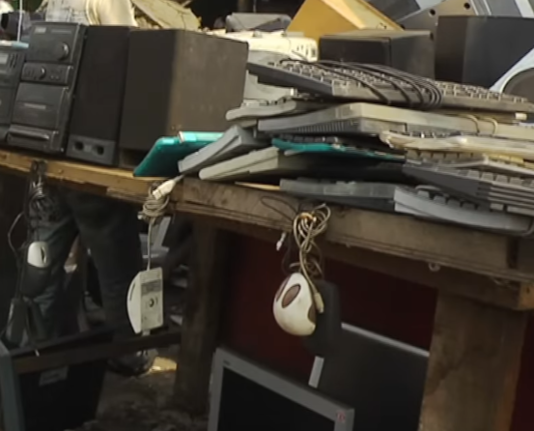 Used Electronics Merchant stand in Agbloboshie, Accra, Ghana: 
On a barely holding-together naked plywood table there are several PC Keyboards and Mice next to speakers and a Stereo System.

Underneath the Table there are several older LCD monitors.

Still frame taken from a Click [BBC] episode...
https://www.youtube.com/watch?v=JXDrIvShZKU&t=220s