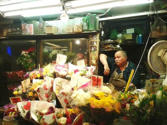 Street shot of long time Flower vendor Peter at 14th St stop on L train at First Avenue by Shell Sheddy #sheshephoto #shellsheddy #sheShePhotography #lesArchives #street #streetphotographers #streetarteverywhere 