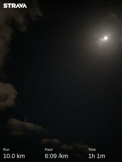 The full moon shines brightly in mostly clear skies. Only one singular star can be seen, nestled amongst the outbound clouds which are quickly being ushered out by the winds trailing the high pressure southward. 

My running stats are along the bottom: 10km in 1:01 for an average pace of 6:09/km