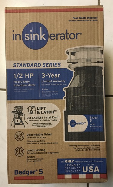 A photo of a box containing an Insinkerator Badger 5 food waste disposer. The box proudly stated “3 year warranty”.
