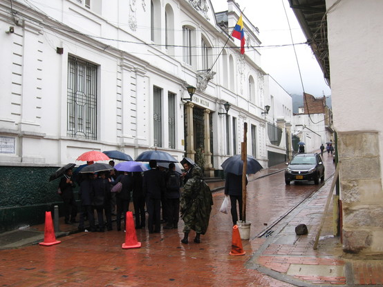 Bogotá 2012. Soldier in waterproofs with umbrellas.