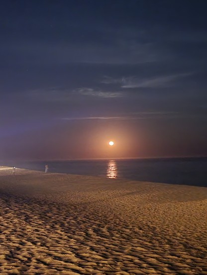 Moon rising over the ocean